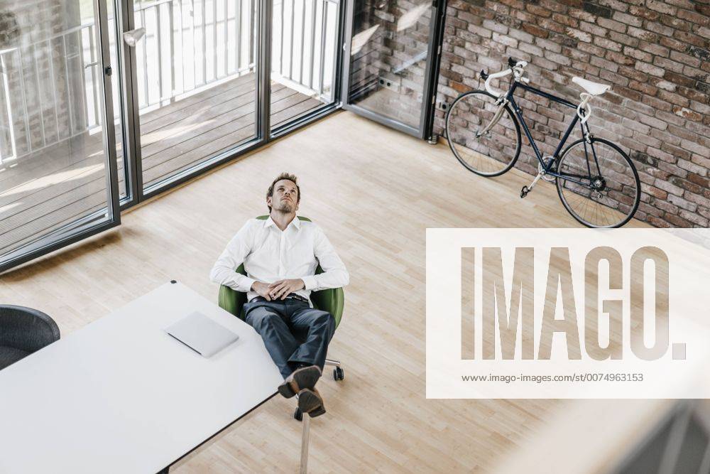 Businessman thinking in office model released Symbolfoto property released KNSF00506