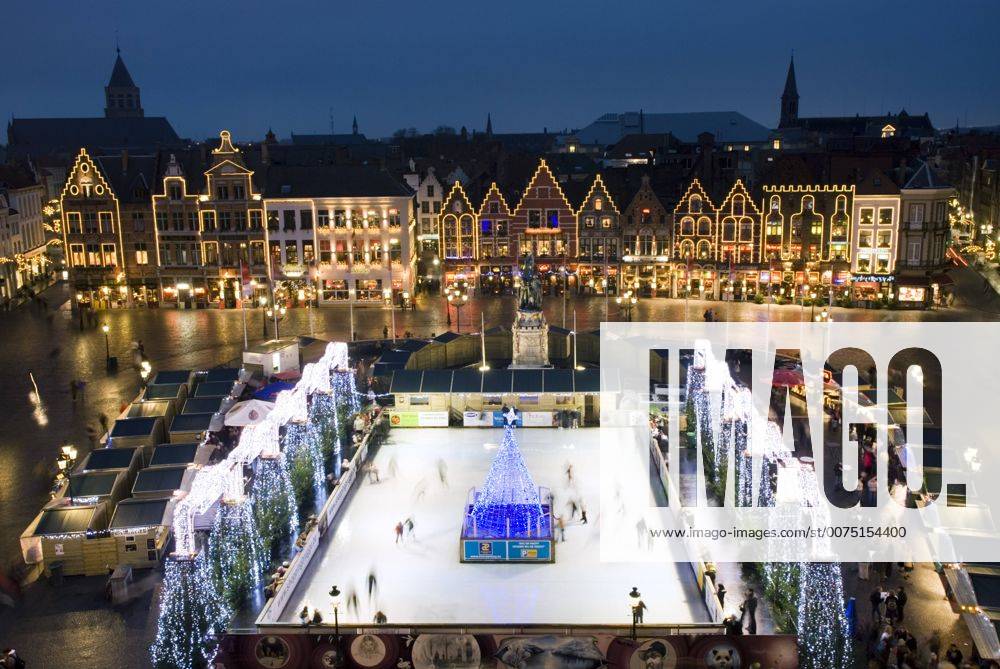 Ice Rink and Christmas Market in the Market Square, Bruges, West Vlaanderen (Flanders), Belgium, Europe