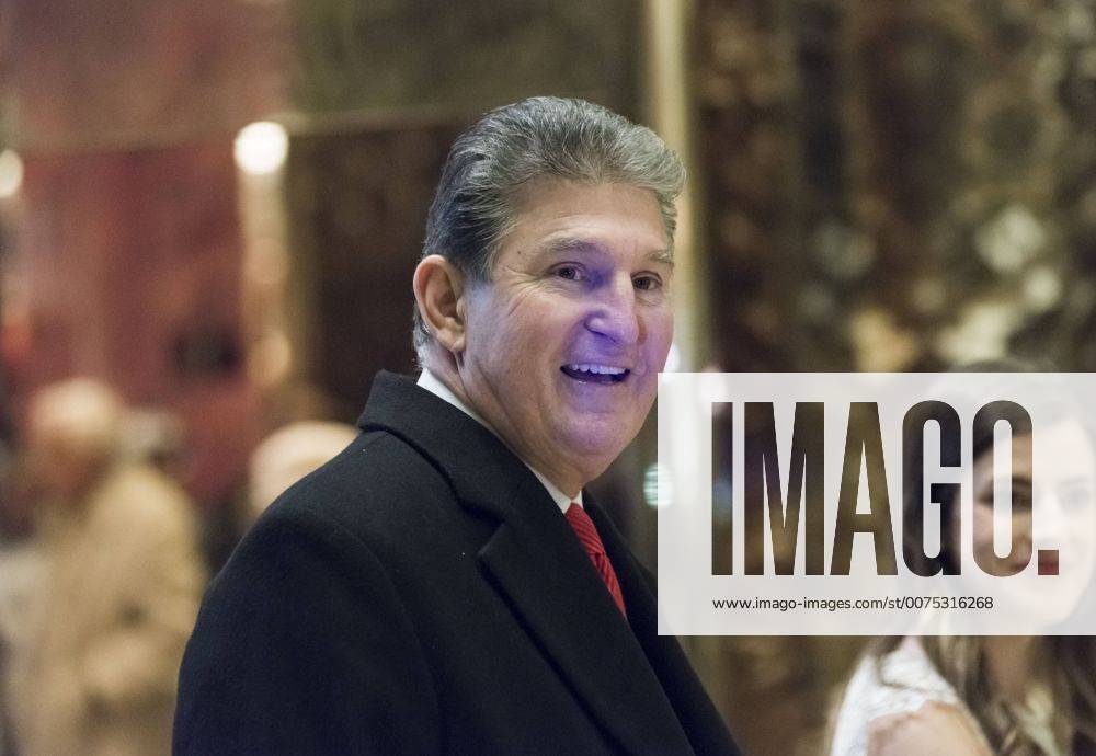New York, New York, United States of America - United States Senator Joe Manchin (Democrat of West Virginia) is seen in the lobby of Trump Tower in New York, NY, USA upon his arrival for a meeting with President-elect Trump on December 12, 2016. .Credit: Pool via CNP New York United States of America - ZUMAs152 20161212_zaa_s152_001