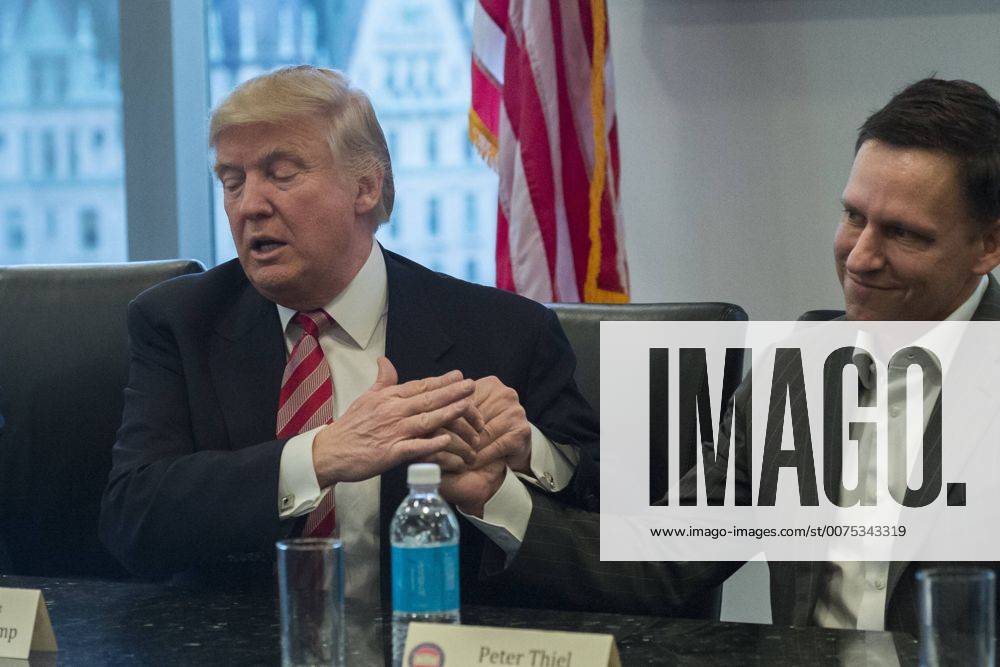 New York, New York, United States of America - United States President-elect Donald Trump is seen at a meeting of technology leaders in the Trump Organization conference room at Trump Tower in New York, NY, USA on December 14, 2016. . New York United States of America - ZUMAs152 20161214_zaa_s152_048