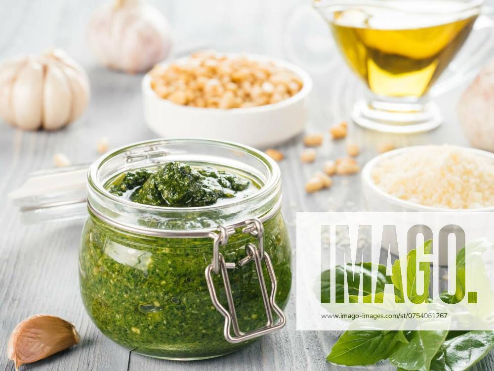 Homemade basil pesto sauce ingredients, Homemade pesto sauce and ingredients on gray wooden background. Close up wiev of basil pesto in glass jar with ingredients., Homemade pesto sauce and ingredients on gray wooden background. Close up wiev of basil pesto in glass jar with ingredients., 12.04.2024,