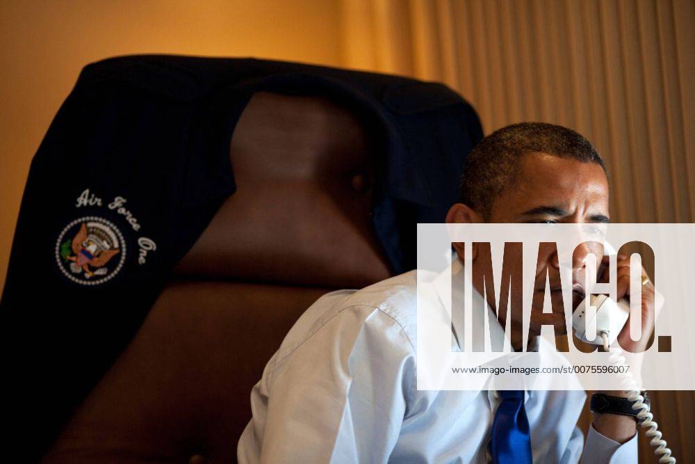 Jul. 09, 2010 - Aboard Air Force One - President Barack Obama talks on the phone with Palestinian Authority President Mahmoud Abbas aboard Air Force One, July 9, 2010. Barack Hussein Obama II (born August 4, 1961) is the 44th President of the United States. He is the first African American to be elected to office and the first president born outside the contiguous United States. Born in Honolulu, Hawaii, Obama is a graduate of Columbia University and Harvard Law School. He worked as a civil rights attorney and taught constitutional law at the University of Chicago Law School from 1992 to 2004. While serving three terms representing the 13th District in the Illinois Senate from 1997 to 2004, he ran unsuccessfully in the Democratic primary for the United States House of Representatives in 2000. Aboard Air Force One - ZUMAz03_ 20100709_shh_z03_818