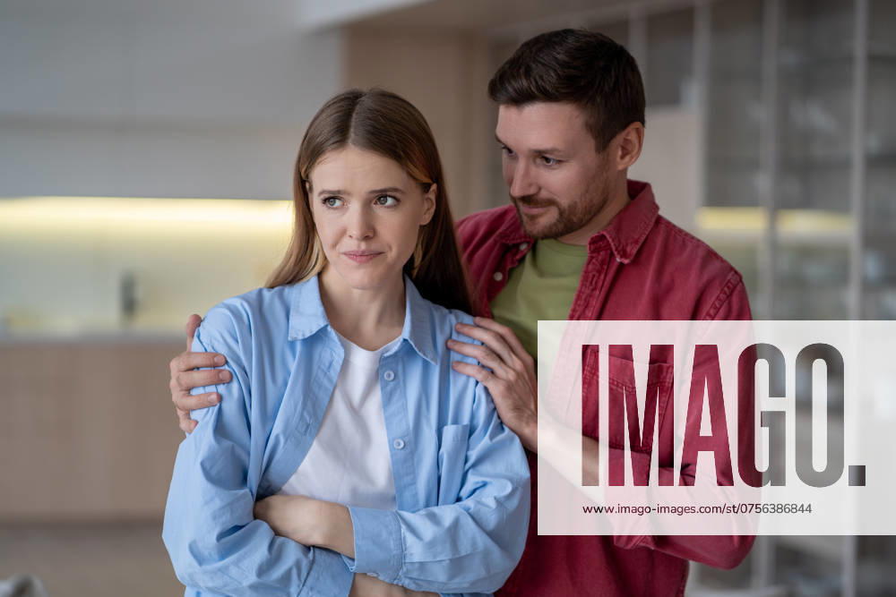 Upset and angry woman with PMS and husband calms and hugs her, provides comfort. Family goals Upset and angry woman with PMS and husband calms and hugs her, provides comfort. Patience, understanding key in managing mood swings and family goals, maintaining harmony with hysterical partner ,model released, Symbolfoto