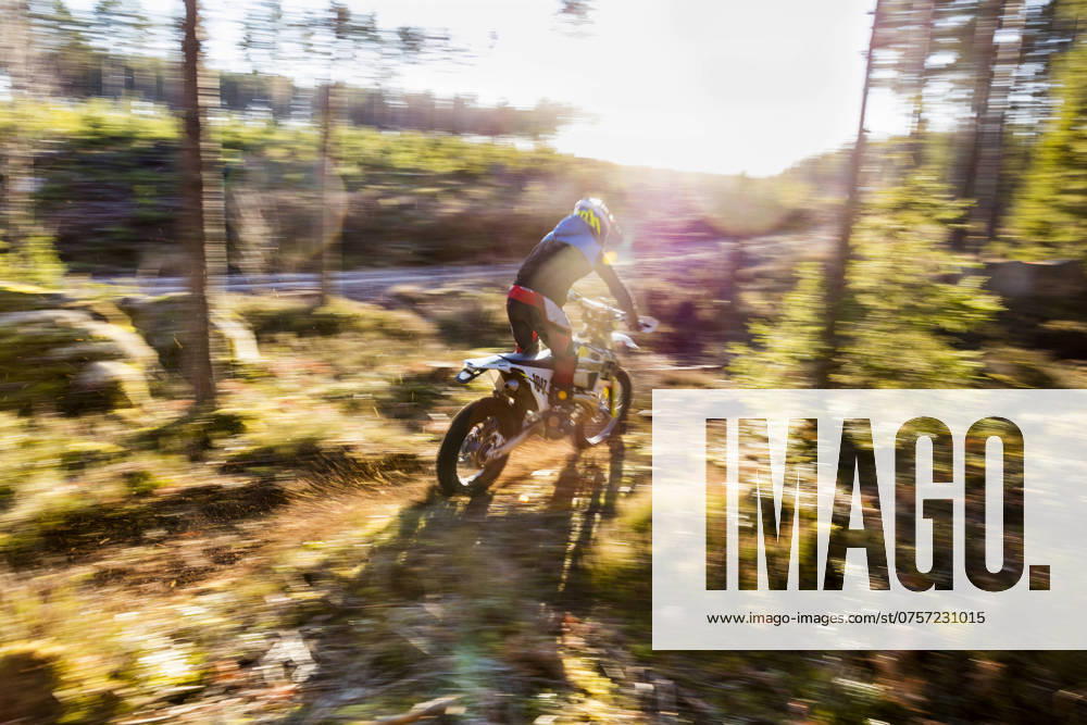 Motocross biker at forest , model released