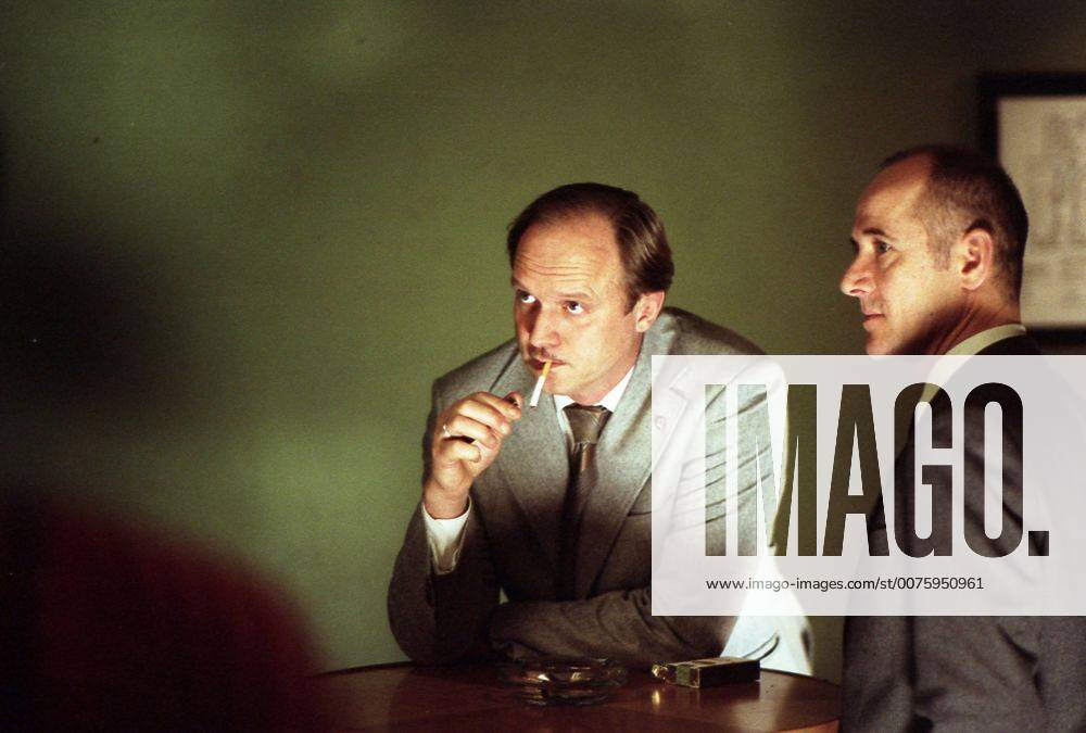 RELEASE DATE: February 9, 2007. MOVIE TITLE: Das Leben der Anderen (North America: The Lives of Others ) - STUDIO: Creado Film Sony Pictures Classics. PLOT: Captain Wiesler (Muhe) is a wiretapping expert with the Stasi (East German Secret Police) in the mid-eighties,who becomes disillusioned with his career and life in general in the former socialist republic when his latest assignment, Georg Dreyman (Koch), a playwright with views against the totalitarian state, starts to challenge his beliefs through his overheard conversations. PICTURED: ULRICH TUKUR as Oberstleutnant Anton Grubitz and ULRICH MUHE as Hauptmann Gerd Wiesler. - ZUMAg90_ 20070209_ddn_g90_484