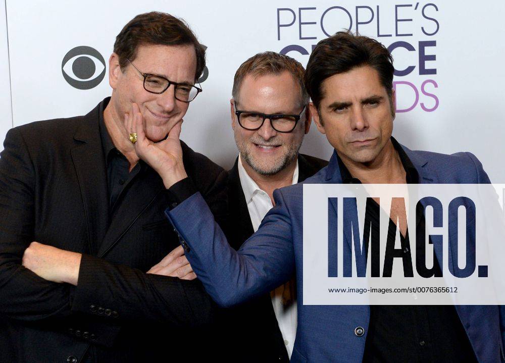 (L-R) Actors Bob Saget, Dave Coulier and John Stamos appear backstage with their award for Favorite Premium Comedy Series for Fuller House during the 43rd annual People s Choice Awards at the Microsoft Theater in Los Angeles on January 18, 2017. LAP20170118374 JIMxRUYMEN