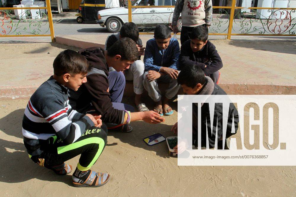 Rafah, Gaza Strip, Palestinian Territory - Palestinian children play marbles in a street in Rafah in the southern Gaza strip on January 19, 2017 Rafah Palestinian Territory - ZUMAap3_ 20170119_zaf_ap3_040
