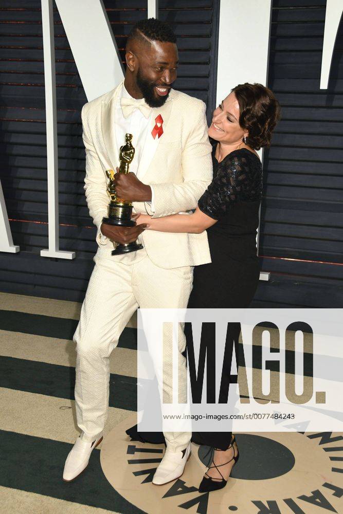 Beverly Hills, CA, United States - 26 February 2017 - Beverly Hills, California - Tarell Alvin McCraney, Adele Romanski. 2017 Vanity Fair Oscar Party held at the Wallis Annenberg Center. Photo Credit: AdMedia Beverly Hills United States - ZUMAa123 20170227_zaa_a123_952