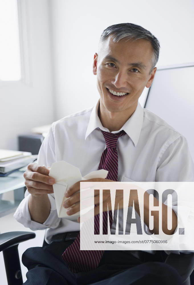 Portrait of smiling businessman holding Chinese take away , 10.01.2010, model released, TTBB_ti0232554.jpg, Portrait,Businessman,Mature Man,Chinese Takeout,Vertical,Indoors,40-44 Years,Chinese Ethnicity,Front View,Short Hair,Holding,Shirt And Tie,One Person,Take Out Food,Day,Sitting,Business,Cheerful,Enjoyment,Happiness,Grey Hair,Office Worker,Food And Drink,Unhealthy Eating,Office,Chinese Food,Looking At Camera,Toothy Smile,Waist Up,Male,One Person Only,Daytime,Cheerfulness,Happy,Enjoy,Enjoying,Gray Hair,Junk Food
