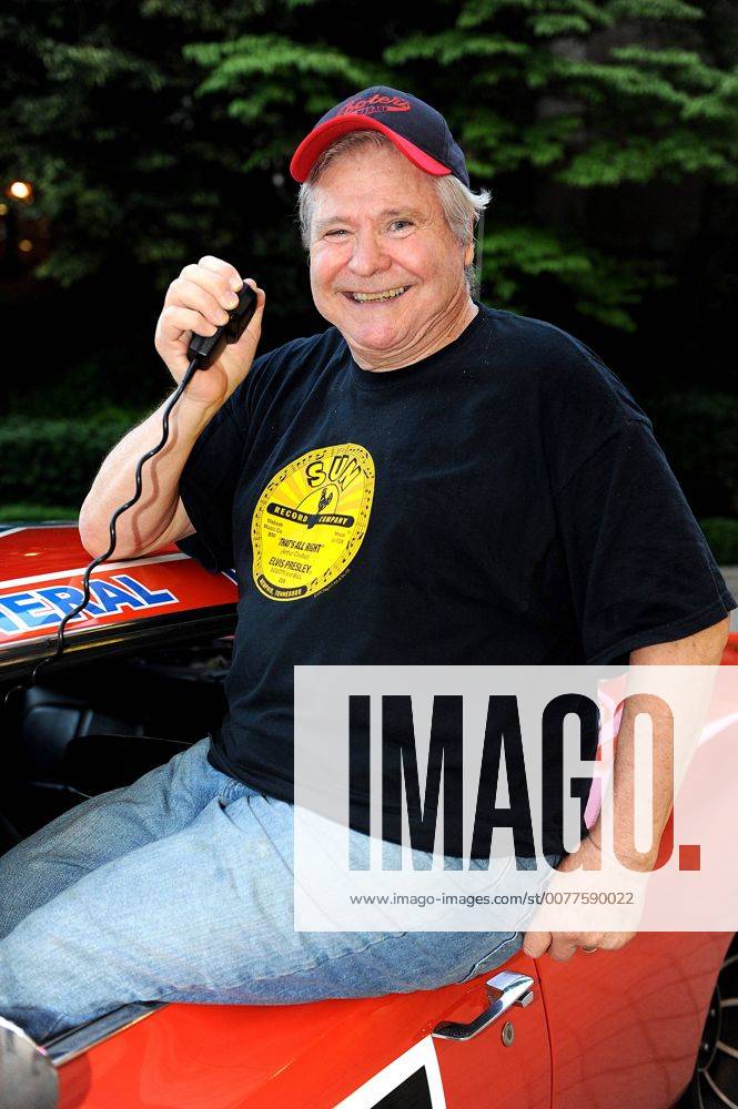 Durham, North Carolina; USA - Singer Actor Politician BEN JONES who played COOTER DAVENPORT in the hit television show The Dukes of Hazzard poses with the famed car from the television series The General Lee while at The Carolina Theater located in Durham. Copyright 2011 . - ZUMAm78_ 20110519_zaf_m78_001