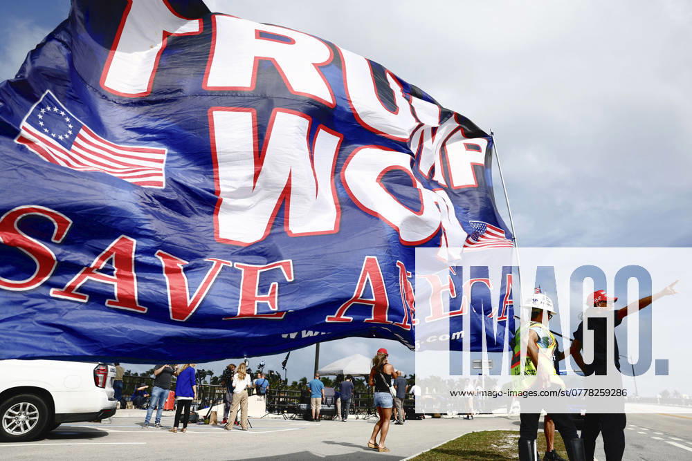 U.S. presidential election Supporters of Republican presidential nominee and former U.S. President Donald Trump raise a flag on a street in Palm Beach, Florida, on Nov. 6, 2024, celebrating his victory in the presidential election. A14AA0003695971P