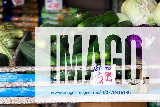A closeup of fresh zucchini in a market with a price tag 26214654 RECORD DATE NOT STATED