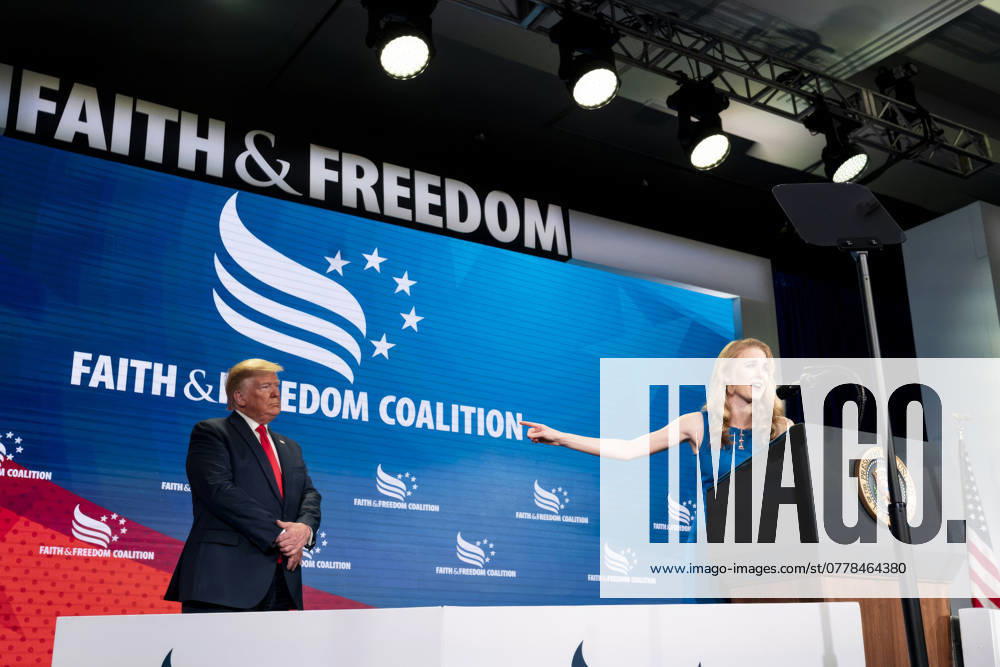 U.S. President Donald Trump, left, listens to Natalie Harp, right, speak after inviting her on stage at a Faith and Freedom Coalition Road to Majority 2019 Conference at the Washington Marriott Wardman Park Hotel, June 26, 2019, in Washington, D.C. Washington United States of America - ZUMAp138 20190626_zaa_p138_005