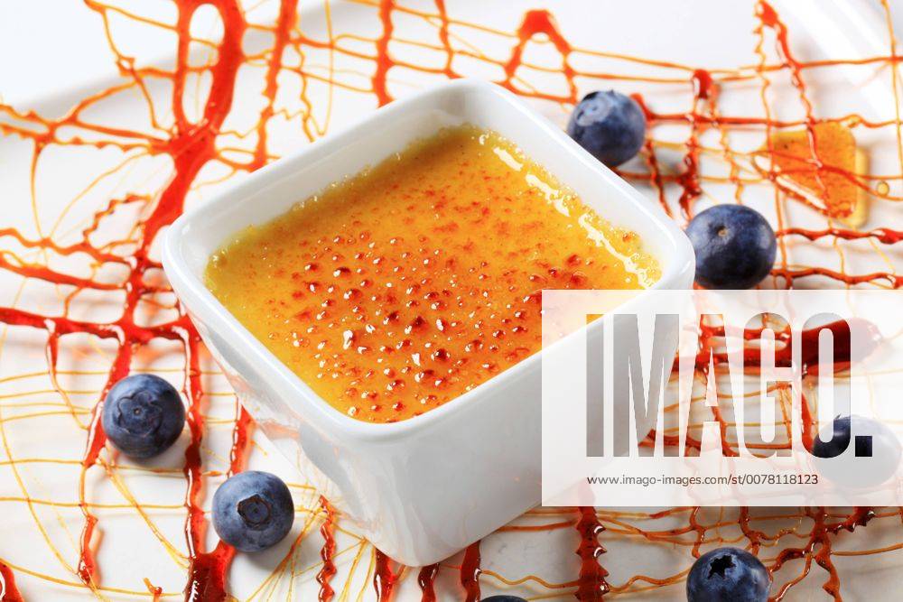 Creme brulee garnished with caramelized sugar decoration and blueberries CTKPhotoF201704110893001