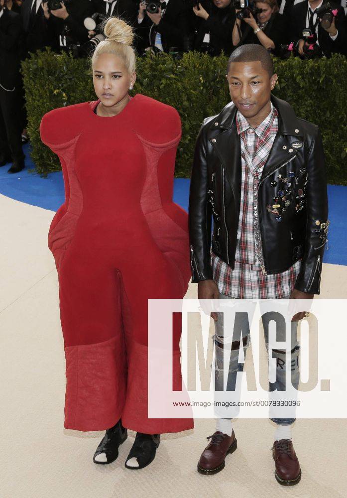 Helen Lasichanh and Pharrell Williams arrives on the red carpet at the Costume Institute Benefit at The Metropolitan Museum of Art celebrating the opening of Rei Kawakubo Comme des Garcons: Art of the In-Between in New York City on May 1, 2017. NYP20170501109 JOHNxANGELILLO