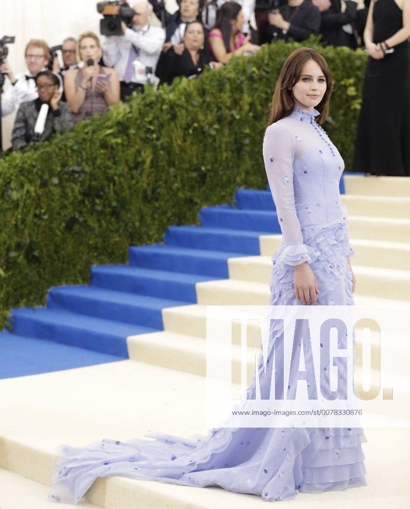 Felicity Jones arrives on the red carpet at the Costume Institute Benefit at The Metropolitan Museum of Art celebrating the opening of Rei Kawakubo Comme des Garcons: Art of the In-Between in New York City on May 1, 2017. NYP20170501588 JOHNxANGELILLO