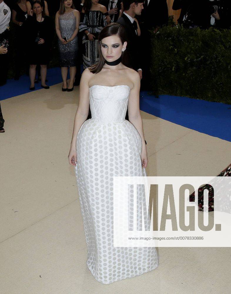 Lily James arrives on the red carpet at the Costume Institute Benefit at The Metropolitan Museum of Art celebrating the opening of Rei Kawakubo Comme des Garcons: Art of the In-Between in New York City on May 1, 2017. NYP20170501530 JOHNxANGELILLO