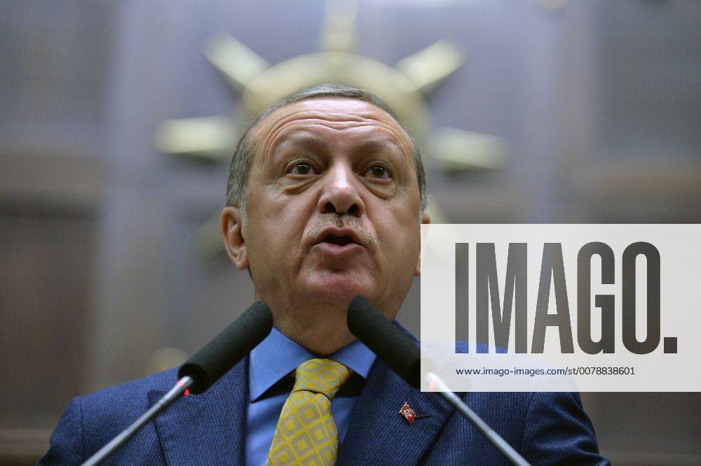 Turkey s President Recep Tayyip Erdogan talks to members of the ruling Justice and Development party (AKP) as he arrives to address them in Ankara, Turkey, Tuesday, May 30, 2017. Erdogan addressed the party for the first time since returning to lead the party following a April 16 referendum on constitutional reforms. (