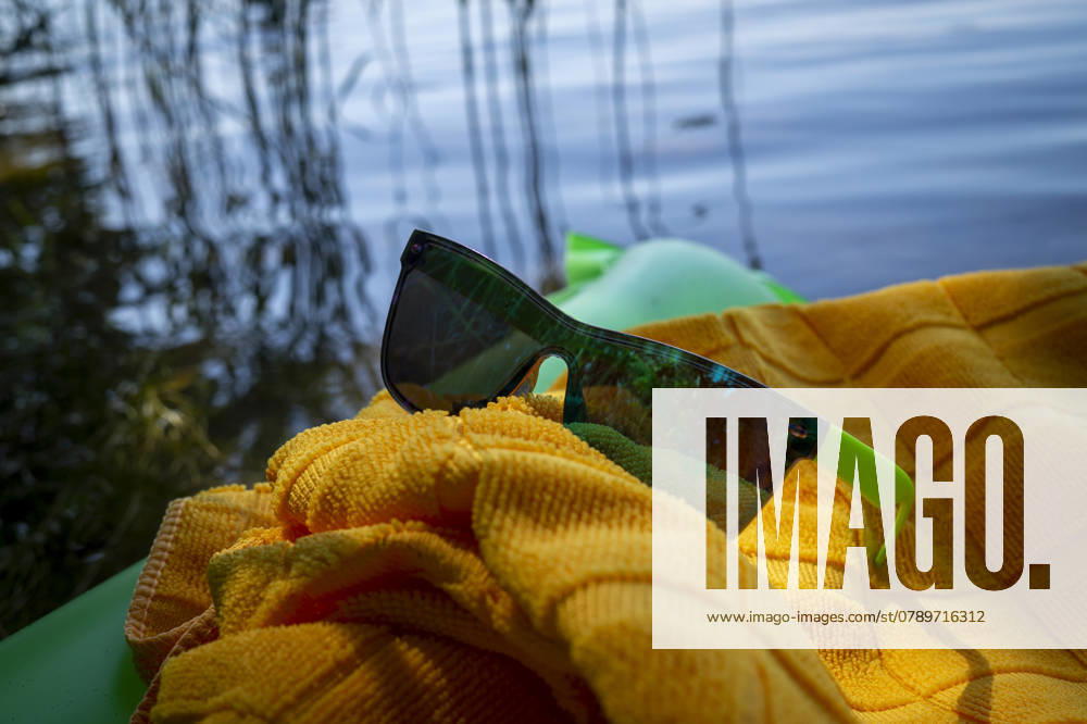 Sunglasses on a yellow towel placed on a green inflatable mattress floating on water in a concept of a summer vacation , 32811794.jpg, vacation, concept, sunglasses, yellow, towel, mattress, floating, water, inflatable, wet, summer, travel, holiday, beach, sea, background, nature, tourism, ocean, beautiful, sun, sand, happy, blue, leisure, fun, relax, lifestyle, design, resort, outdoors, relaxation, sunny, coast, happiness, symbol, season, journey, day, beauty, abstract, natural, shore, vintage, adventure, recreation, vacations, nobody, rest RECORD DATE NOT STATED