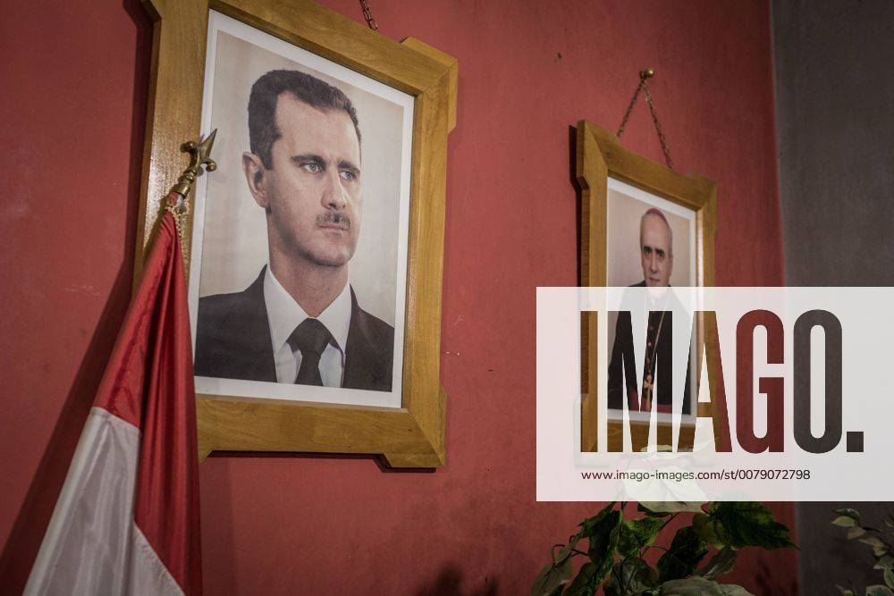 - SYRIA - THE MARTYRDOM OF KHABOUR S ASSYRIANS - 17 12 2016 - northern syria Hassake Hassake - Syria Nord Dec16 - In a Catholic church, the portrait of Bashar el Assad is hung next to that of the Archbishop. Assad has always protected the Christian minorities, who are his allies in the north. ChrisxHubyx Pictorium LePictorium_0159712
