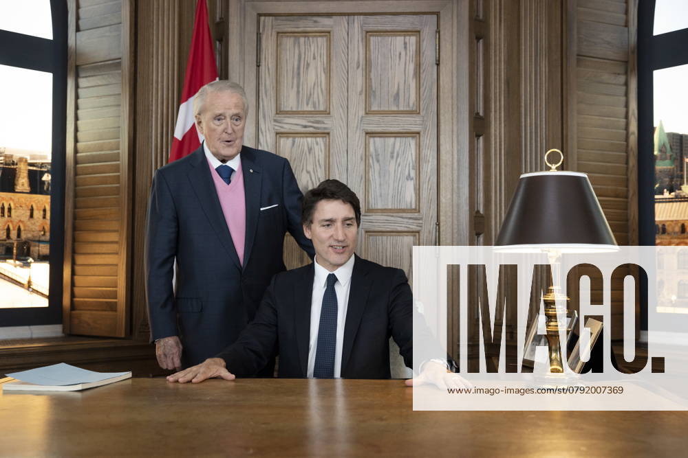 Prime Minister Justin Trudeau, right, sits behind the desk of former prime minister Brian Mulroney, left, while touring a replica of Mr. Mulroney s former parliamentary office in Mulroney Hall at St. Francis Xavier University in Antigonish, N.S. on Monday, June 19, 2023. Antigonish Canada - ZUMAc35_ 20230619_zaf_c35_111