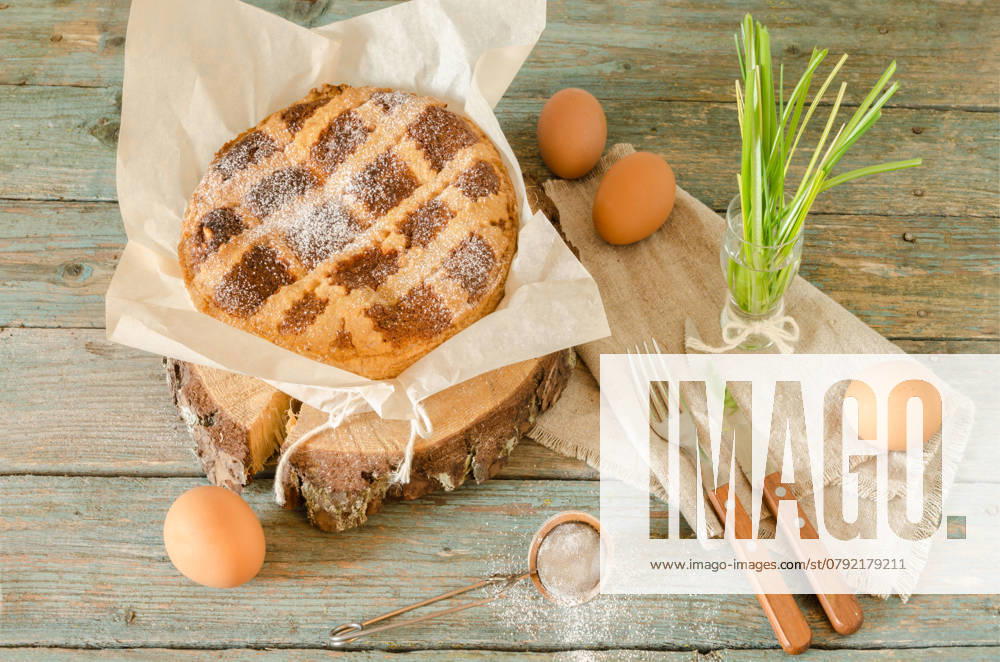 Neapolitan Easter cake with ricotta and wheat on old wooden table. Next egg, knife and fork. Rustic style. , 45839586.jpg, italian, easter, sweet, ricotta, cake, cuisine, pastry, food, dessert, italy, cheese, neopolitan, culture, baking, traditional, pie, baked, celebrations, crust, wheat, campania, tart, fork, knife, cereal, holiday, wood, cutting, color, nobody, powdered, pastiera, neapolitan, wooden, slice, eggs, table, closeup, natural, spring, easy baking recipes, nona, recipe, horizontal, photography, still life, retro style, rustic, authentic RECORD DATE NOT STATED