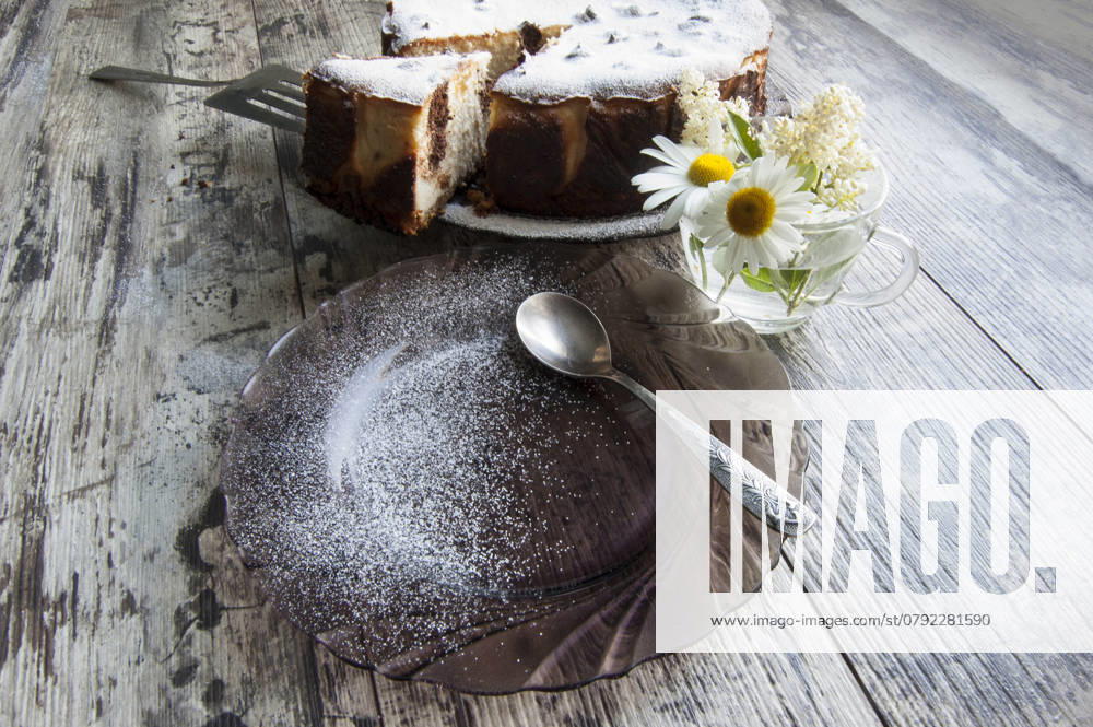 Cheesecake on an old table with a bouquet of daisies and a form for baking. Retro style. From the series Still Life with cheesecake , 46005236.jpg, celebrations, dessert, chocolate, food, sweet, flower, cake, cheesecake, cheese, baking, decoration, table, gourmet, single, eating, plate, temptation, brown, traditional, biscuit, easter, cherry, refreshment, pastry, white, dishware, homemade, close-up, colors, cream, freshness, portion, tablecloth, nobody, yellow, life, breakfast, spoon, wood, part, amomile, glass cup, bouquet, packaging paper, still life, retro, horizontal RECORD DATE NOT STATED