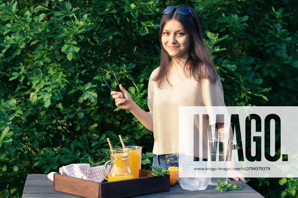 Girl cooking summer orange cocktail with mint and ice cubes outdoors, selective focus., model released, , 47591176.jpg, cocktail, drink, orange, girl, glasses, homemade, young, summer, ice, hands, juice, mint, glass, tongs, selective focus, beverage, food, fresh, healthy, fruit, green, making, lemonade, women, female, vegan, refreshing, cooked, leaf, cooking, cold, caucasian, natural, sweet, long, harvest, vitamin, citrus, table, dark, antioxidant, hair, ingredient, recipe, straw, organic, cool, freshness, photo, image RECORD DATE NOT STATED