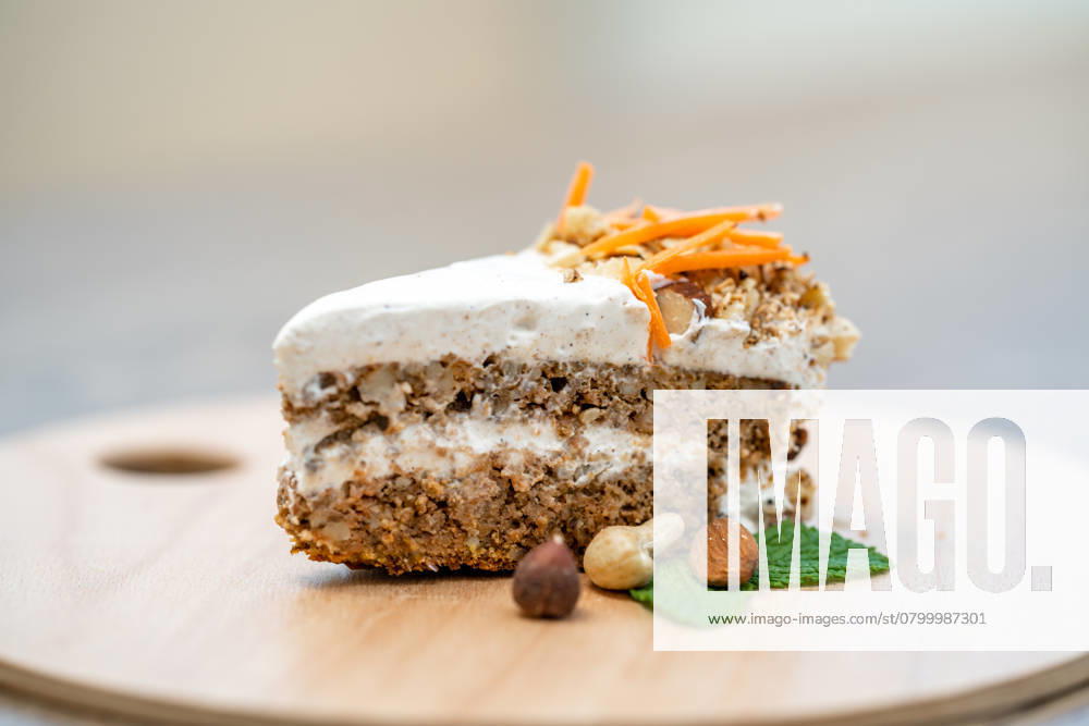 Carrot cake on a wooden tray. , 49454068.jpg, food, cake, dessert, carrot, homemade, sweet, treat, cream, vegetable, pastry, delicious, decoration, walnut, fresh, tasty, baked, frosting, cooking, recipe, nutrition, bakery, healthy, appetizing, orange, gourmet, ingredient, meal, layer, snack, calorie, brown, sugar, sliced, cheese, plate, slice, bake, table, wooden, easter, calories, biscuit, organic, holiday, icing, nutritious, vegetarian, traditional, background, birthday RECORD DATE NOT STATED