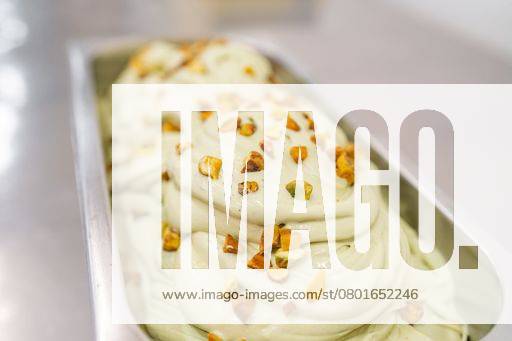 Horizontal photo of tray with pistachio ice cream with pieces of pistachio 18495355 RECORD DATE NOT STATED