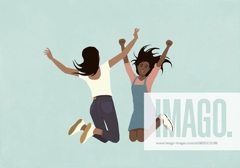 Happy teenage girls jumping for joy with arms raised on blue background