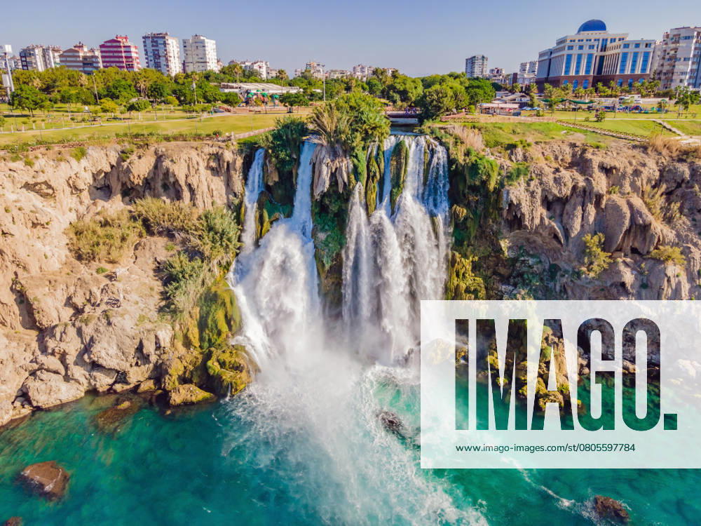 Lower Duden Falls drop off a rocky cliff falling from about 40 m into the Mediterranean Sea in amazing water clouds. Tourism and travel destination photo in Antalya, Turkey. Turkiye , 51468238.jpg, waterfall, duden, turkey, Turkiye, antalya, water, stone, nature, sea, tourism, river, rock, fall, green, travel, landscape, park, cliff, city, outdoors, wave, summer, resort, high, tree, beach, mediterranean, landmark, background, holiday, low, outdoor, lower, district, flowing, vacations, house, sun, falling water, tourist, canyon, foam, touristic, cascade, boat, building, stream, seaside, view, coastline RECORD DATE NOT STATED