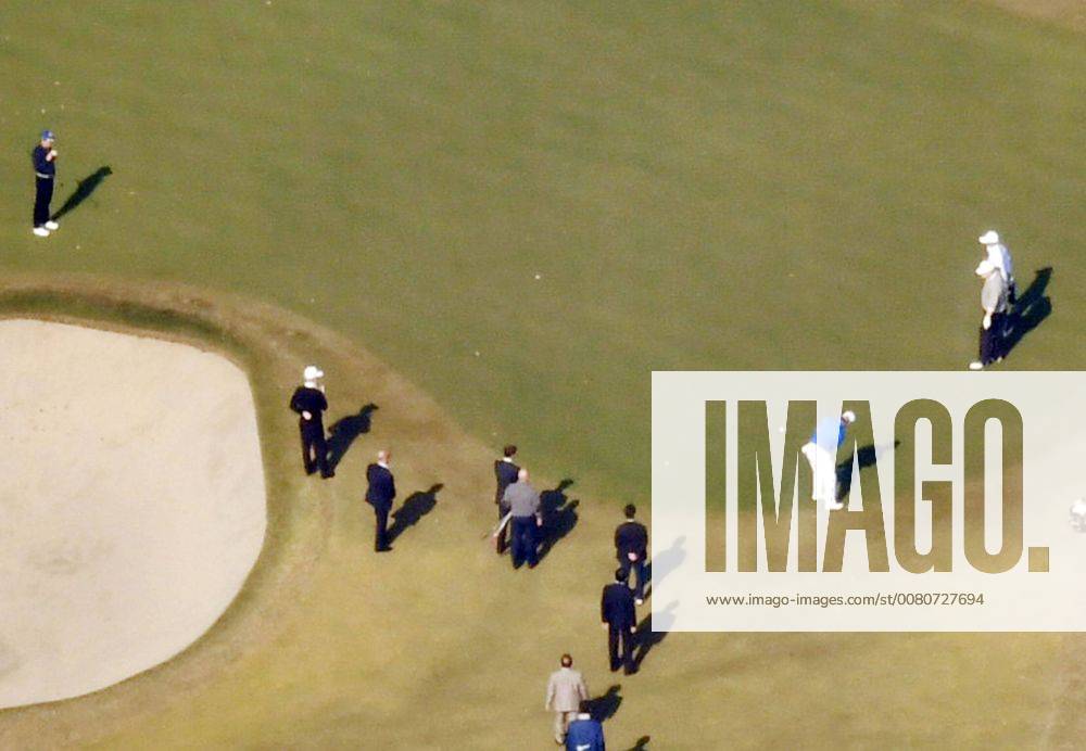 Trump in Japan Professional golfer Hideki Matsuyama (C, blue top) putts as U.S. President Donald Trump (R, front) and Japanese Prime Minister Shinzo Abe (far L) watch at Kasumigaseki Country Club in Kawagoe, Saitama Prefecture, on Nov. 5, 2017. Photo was taken from a Kyodo News helicopter.
