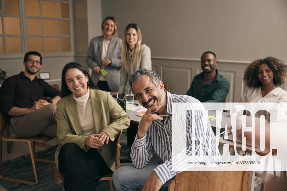 Portrait of happy multiracial male and female creative professionals in meeting room at office Sweden, Stockholm, model released, property released