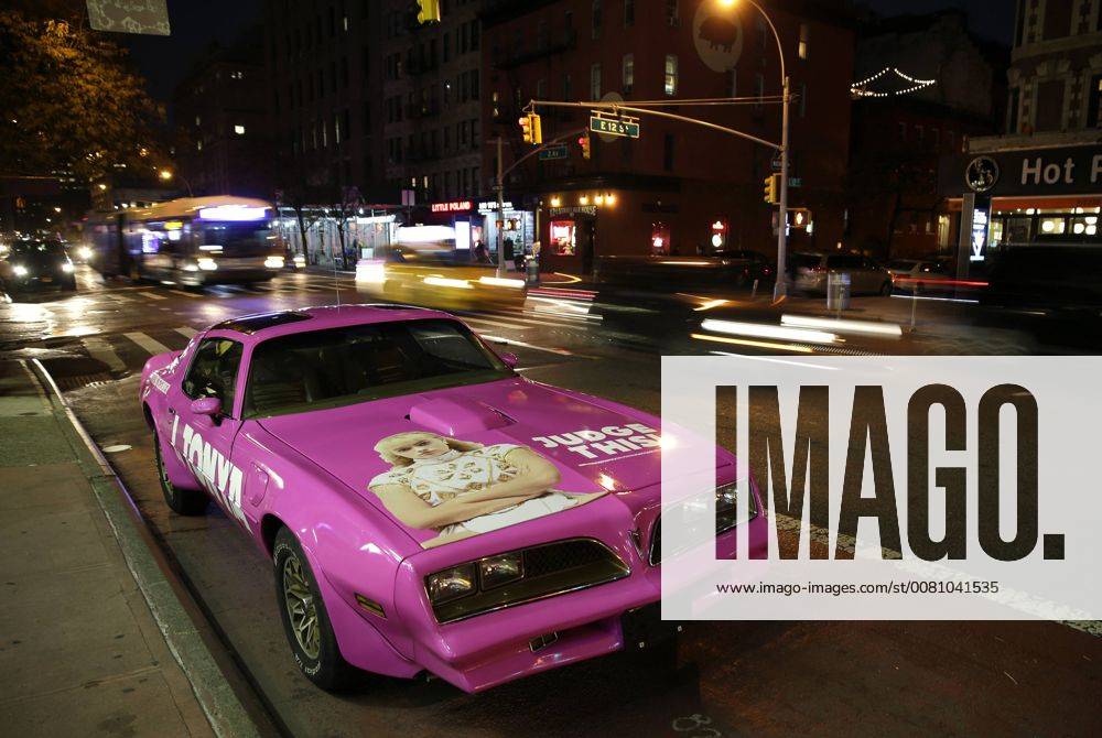 A pink classic car with the I Tonya movie logo and the image of Margot Robbie is parked on the street in in front of the theater before the I, Tonya New York Premiere at Village East Cinema on November 28, 2017 in New York City. NYP20171128137 JOHNxANGELILLO