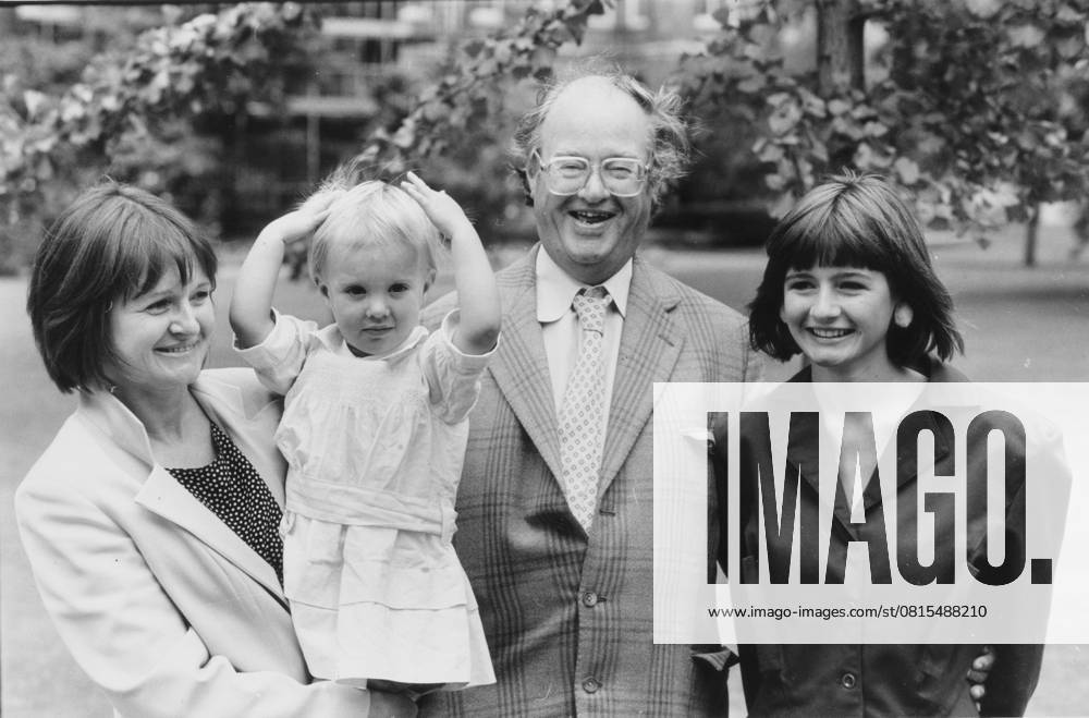 John Mortimer, author of Paradise Postponed is see John Mortimer, author of Paradise Postponed is seen her with his wife Penny, daughter Rosamund, aged two and daughter Emily aged 14 at a Thames TV Garden Party, 31.08.1986. Pic: Paul Lovelace, The Times.