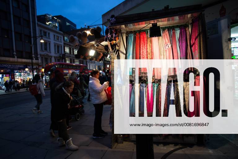 London, United Kingdom - People seen buying clothes from a street vendor on Oxford Street in London. London United Kingdom - ZUMAs197 20180122_zab_s197_023