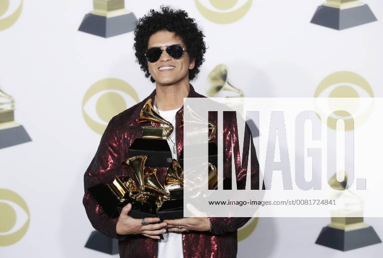 Bruno Mars arrives in the press room with his six Grammy Awards at the 60th Annual Grammy Awards ceremony at Madison Square Garden in New York City on January 28, 2018. The CBS network will broadcast the show live from Madison Square Garden in New York City. It will be the first time since 2003 that the ceremony will not be held in Los Angeles. NYP20180128868 JOHNxANGELILLO