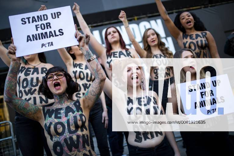 London, London, UK - London, UK. PETA demonstrators protest against the use of animal products at London Fashion Week. They have the slogan Wear Your Own Skin painted across their bodies. London UK - ZUMAl94_ 20180216_zaf_l94_002