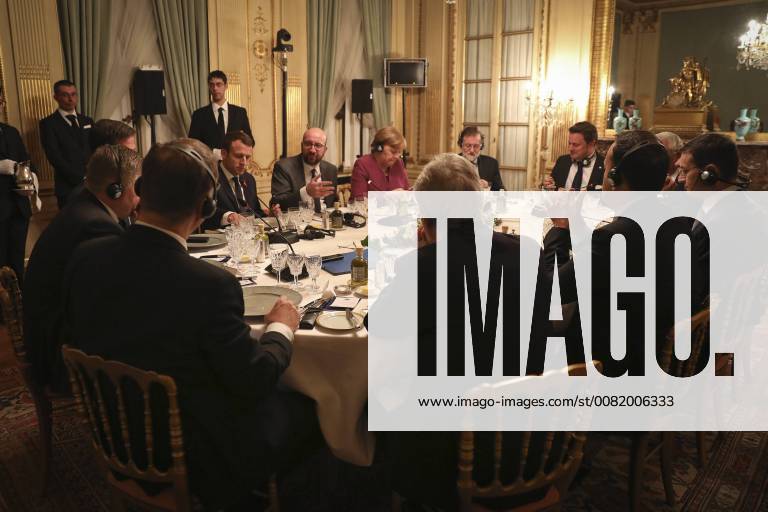 Belgian Prime Minister Charles Michel (C) talks, with President of France Emmanuel Macron (C-L) and Chancellor of Germany Angela Merkel (C-R) and others listening, during an informal dinner for European Heads of State, hosted by the Belgian Prime Minister at the Val Duchesse - Hertoginnedal Castle in Auderghem - Oudergem, Brussels Thursday 22 February 2018. CHANCELLERIExOFxTHExPRIMExMINISTER 05301294