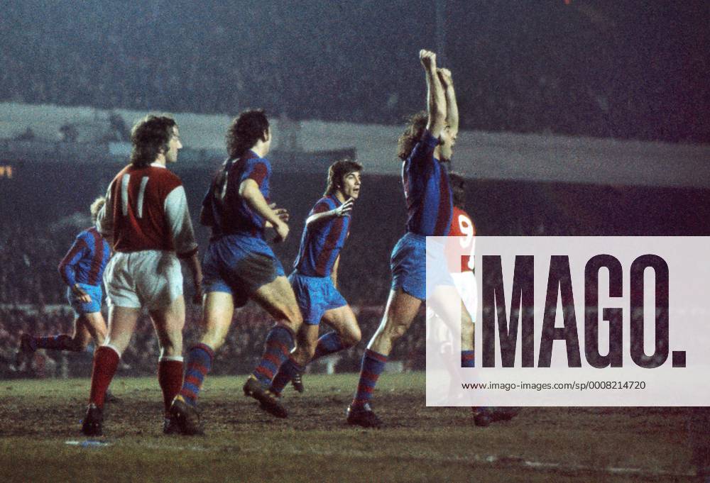 Asensi (Barcelona) celebrates their goal after the ball had hit the crossbar.George Armstrong (left). - Arsenal FC London vs. FC Barcelona - Testimonial - Highbury. 12 03 1974