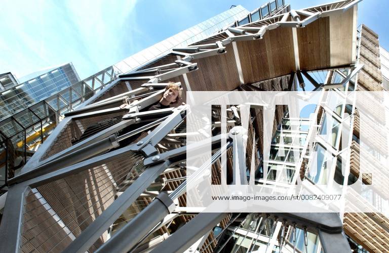 Picture by Roger Bamber: 6 September 2004: Bridge Art.. Sculptor Thomas Heatherwick stands in his curled up Rolling Bridge in Paddington Basin, London ready for the launch of Three Bridges by the Public Art Development Trust and The Paddington Development Corporation. The hydraulic rolling bridge, which uncurls to straddle the canal, is accompanied by a rotating Helix Bridge by Marcus Taylor and a glass bridge by Langlands and Bell.,