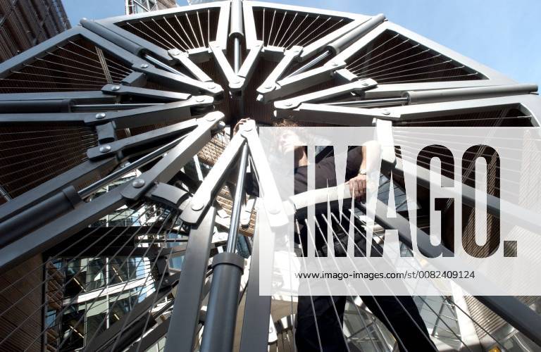 Picture by Roger Bamber: 6 September 2004: Bridge Art.. Sculptor Thomas Heatherwick stands in his curled up Rolling Bridge in Paddington Basin, London ready for the launch of Three Bridges by the Public Art Development Trust and The Paddington Development Corporation. The hydraulic rolling bridge, which uncurls to straddle the canal, is accompanied by a rotating Helix Bridge by Marcus Taylor and a glass bridge by Langlands and Bell.,