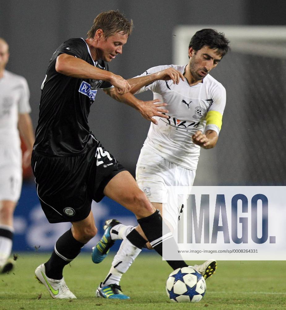 FUSSBALL - UEFA CL Quali, Zestafoni vs Sturm TIFLIS,GEORGIEN,26.JUL.11 - FUSSBALL - UEFA Champions League, Qualifikation, FC Zestafoni vs SK Sturm Graz. Bild zeigt Roman Kienast (Sturm) und Mamuka Kobakhidze (Zestafoni).