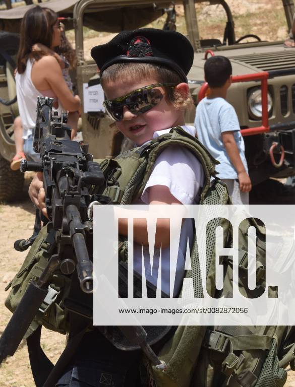 A Jewish boy wears army gear and holds an assault weapon on Israel s 70th Independence Day at a military display in the Ma ale Adumim Jewish Settlement, West Bank, April 19, 2018. JER2018041909 DEBBIExHILL
