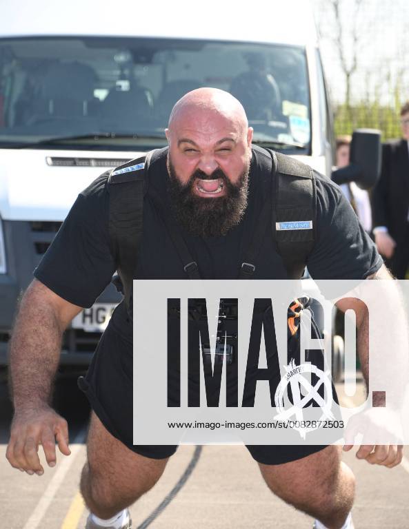 England s Strongest Man and Britain s Strongest Man Laurence Shahlaei visits Abbey Park School in Swindon where he pulled a minibus full of students. APRIL 19th 2018 RWNx181122