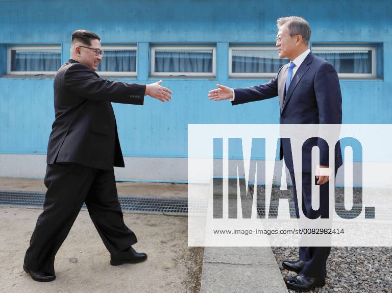 Inter-Korean summit South Korean President Moon Jae In (R) and North Korean leader Kim Jong Un greet each other at the border between their countries at Panmunjeom in the Demilitarized Zone on April 27, 2018. (Korea Summit Press Pool)