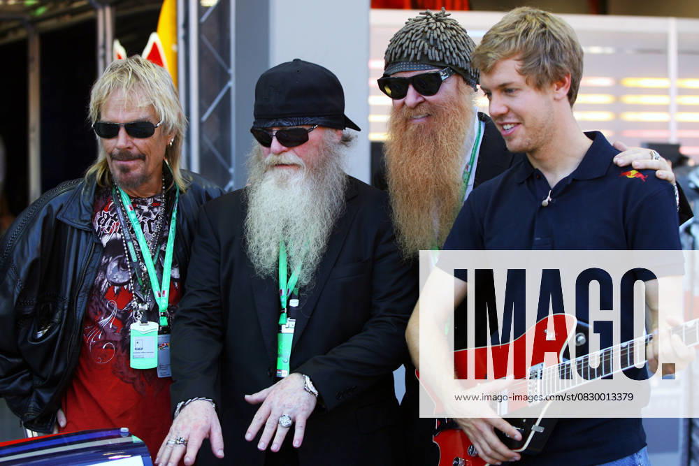 F1 2009 - rd14 Singapore GP - Preparations Sep. 24, 2009 - Singapore - Sebastian Vettel (GER) Red Bull Racing with rock band ZZ Top (L to R): Frank Beard (USA) Drummer; Dusty Hill (USA) ZZ Top bassist; and Billy Gibbons