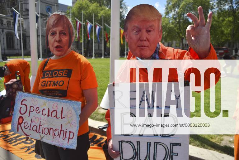 London, England, United Kingdom - Demonstrators wear the iconic orange prisoner s uniform as they demonstrate outside the Parliament asking for Guantanamo prison to be closed, London on May 9, 2018. The Guantanamo Bay detention camp is a United States military prison located within Guantanamo Bay Naval Base, also referred to as GuantoÂ¡namo or GTMO, which is on the coast of GuantoÂ¡namo Bay in Cuba. The camp was established by President George W. Bush s administration in 2002 during the War on Terror. London United Kingdom - ZUMAn230 20180509_zaa_n230_975
