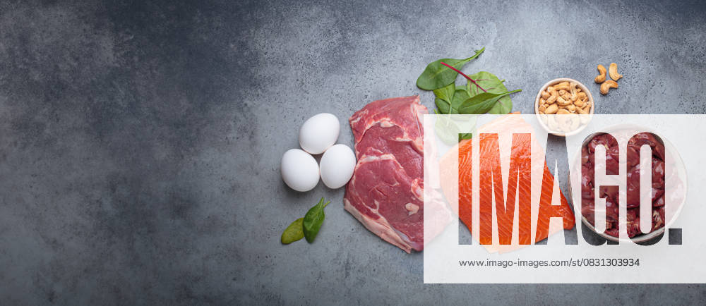 Food ingredients high in iron for health and wellness top view on grey concrete background Fresh salmon fillet, raw beef, nutritious eggs, spinach, nuts cashews and liver arranged on a gray background, iron rich foods essential for a balanced diet concept, 63574864.jpg RECORD DATE NOT STATED